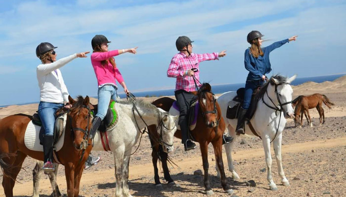 Horse riders on the beach in Hurghada